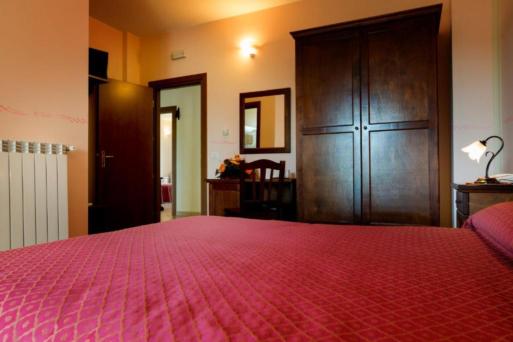 Postel nebo postele na pokoji v ubytování Hotel Salento