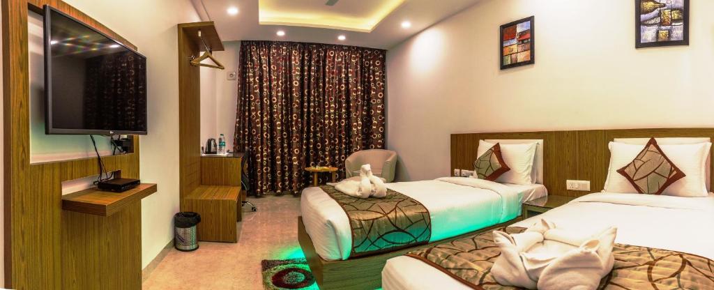 Postel nebo postele na pokoji v ubytování Hotel Suktara International