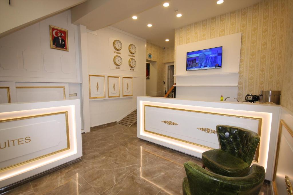 a room with a chair and a tv on a wall at Vita Suites Karaköy in Istanbul