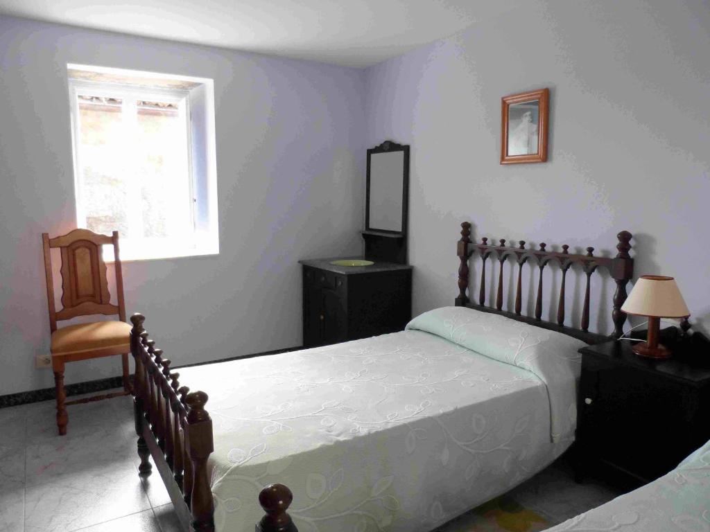 מיטה או מיטות בחדר ב-Casa Madrileños