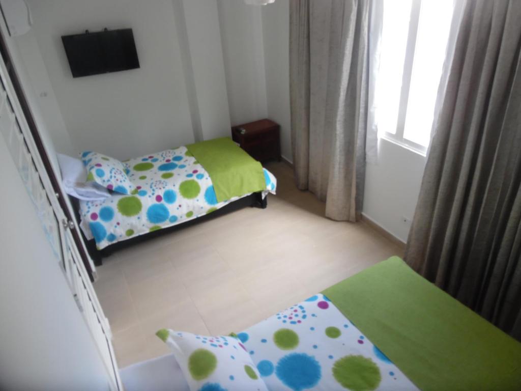Postel nebo postele na pokoji v ubytování Hotel Olas