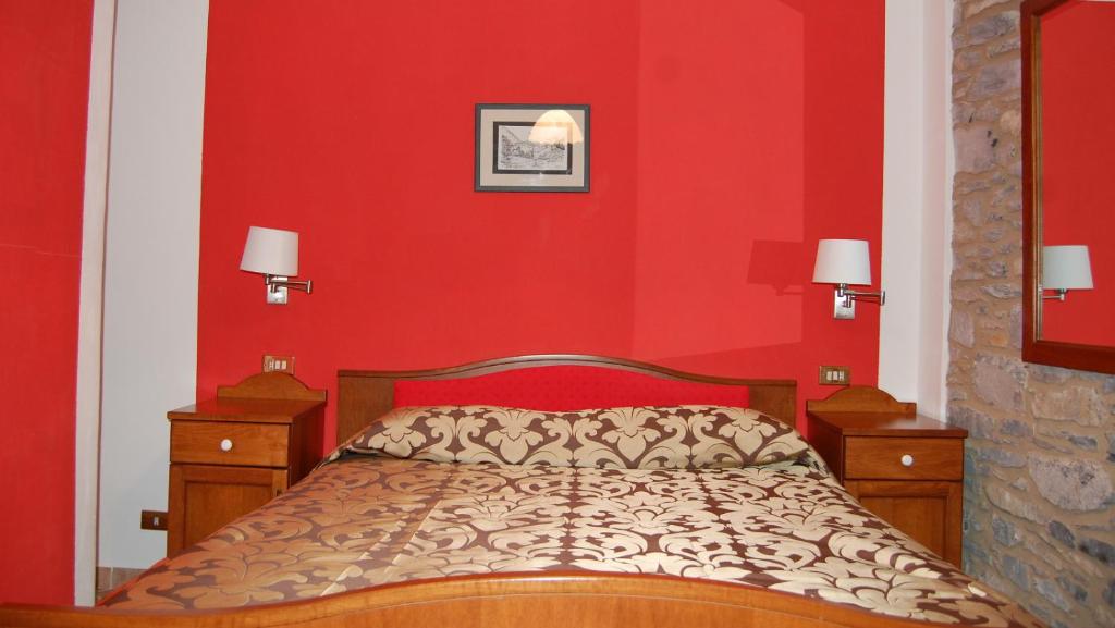 Postel nebo postele na pokoji v ubytování Albergo Miramonti