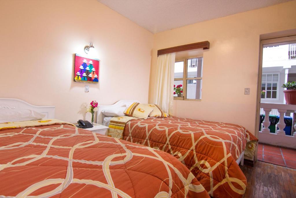Postel nebo postele na pokoji v ubytování Hotel Europa