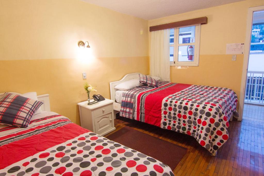 Postel nebo postele na pokoji v ubytování Hotel Europa
