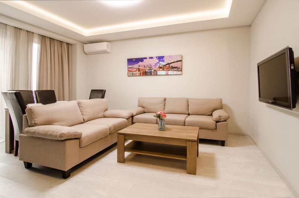 a living room with a couch and a coffee table at Amazing apartment in the center of Kiev in Kyiv