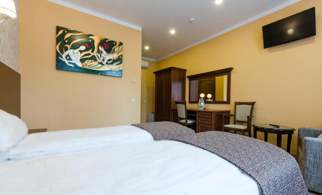 Postel nebo postele na pokoji v ubytování Gogol Park Rooms