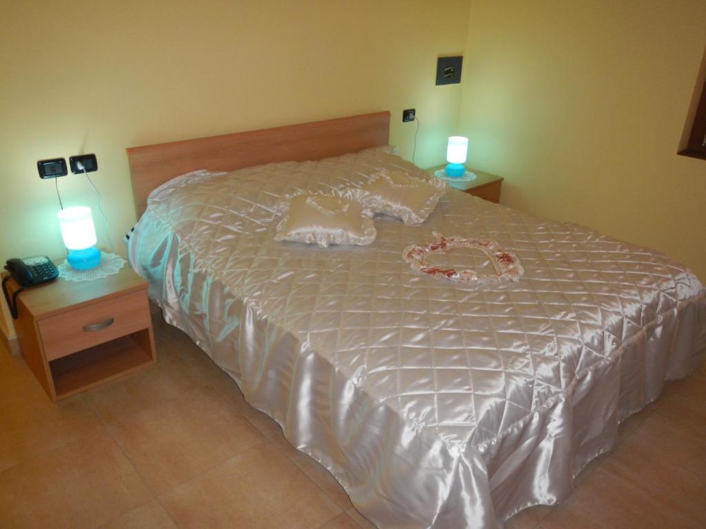 A bed or beds in a room at Affittacamere La Martina
