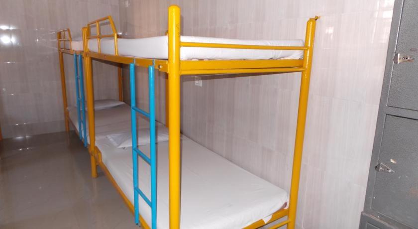 a bunk bed in a small room with at vrs dormitary in Mysore