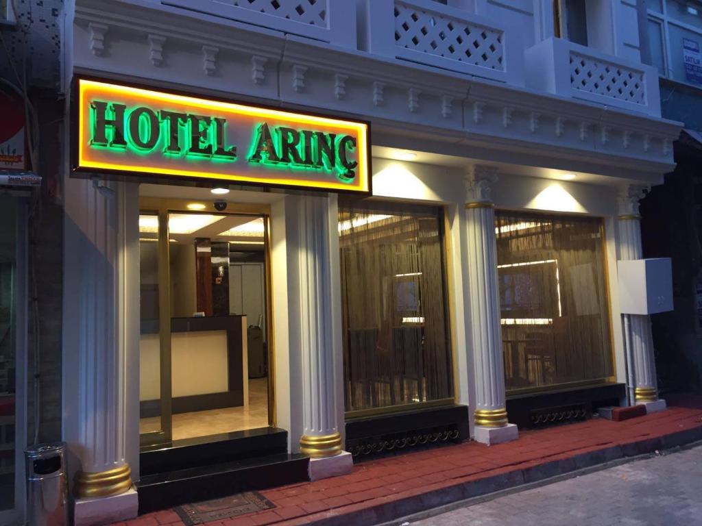 a hotel entrance with a sign for a hotel wing at ARINÇ HOTEL in Istanbul