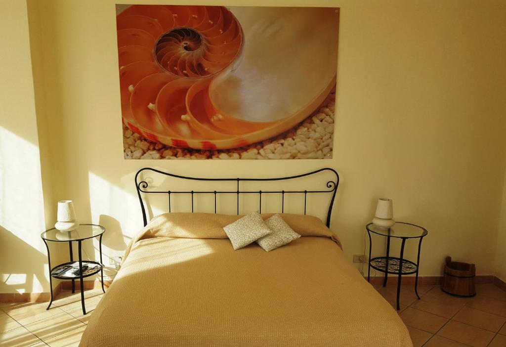 Postel nebo postele na pokoji v ubytování B&B Stella Marina