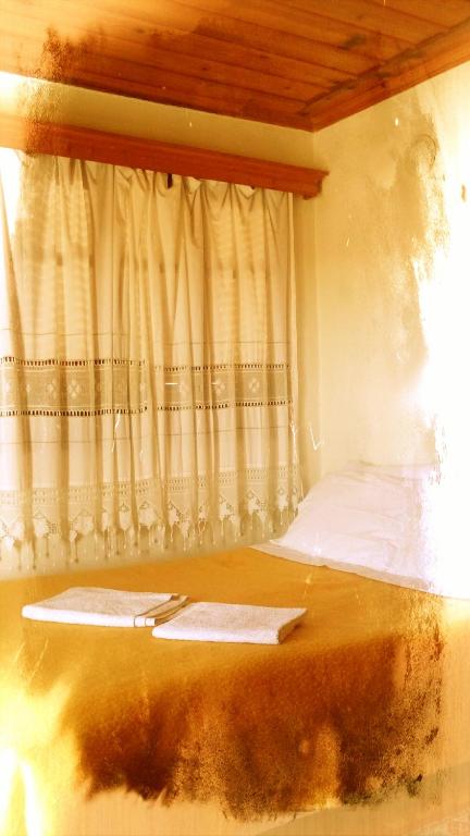 Postel nebo postele na pokoji v ubytování Guesthouse Gouris