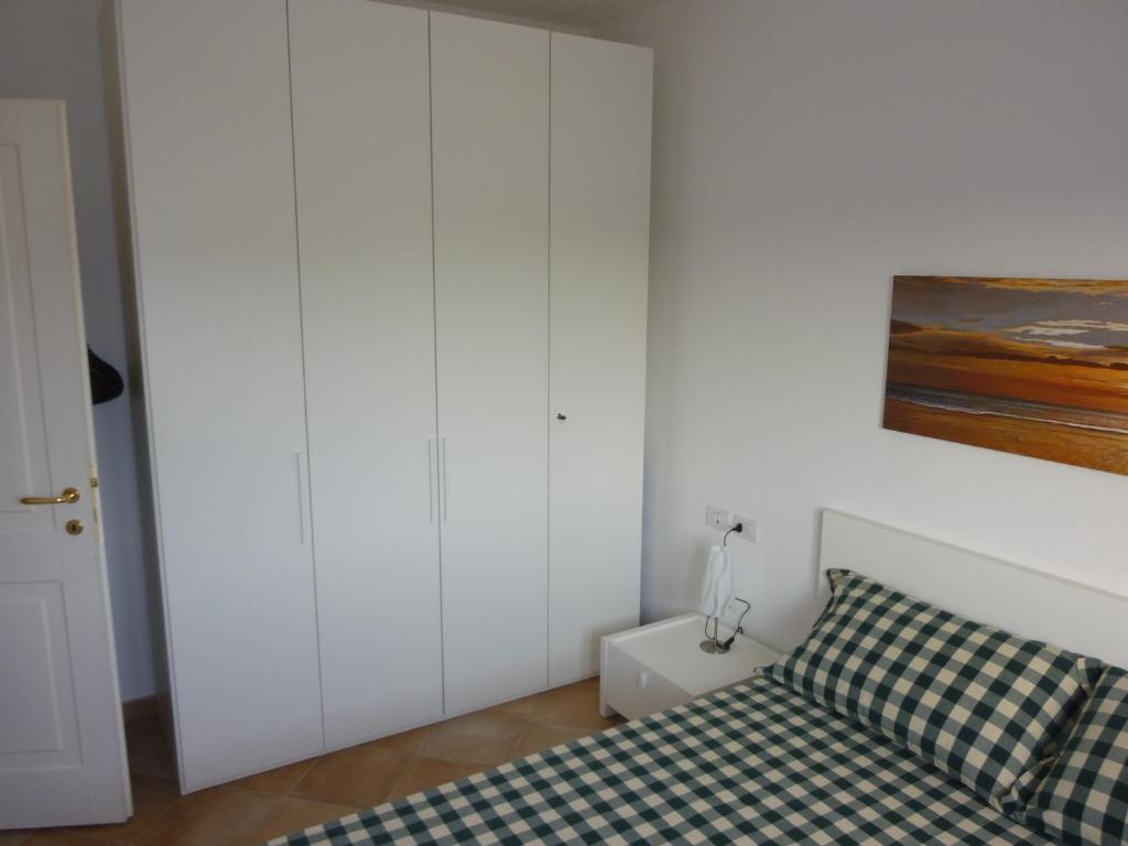 Postel nebo postele na pokoji v ubytování Appartamento in residence fronte mare