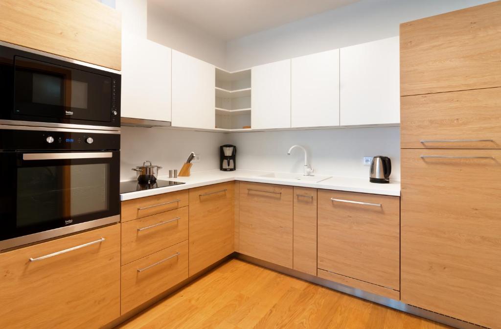 Kuchyň nebo kuchyňský kout v ubytování Apartments Residence Grand