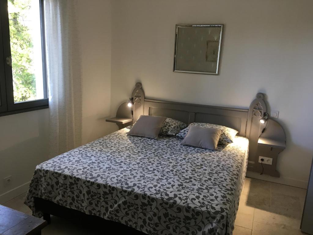 Postel nebo postele na pokoji v ubytování Gîte le Figuier
