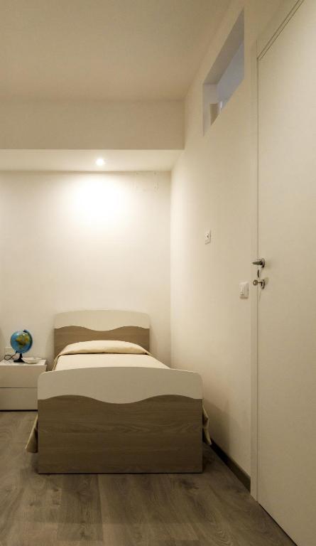 Postel nebo postele na pokoji v ubytování B&B Il più bello dei mari