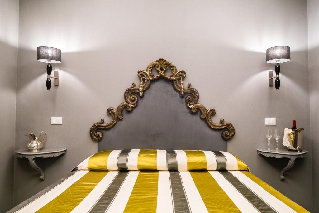 Postel nebo postele na pokoji v ubytování Hotel Antica Locanda