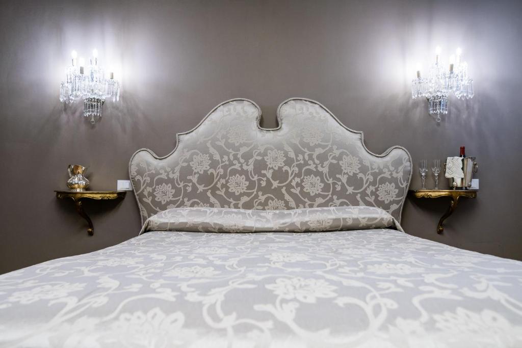 Postel nebo postele na pokoji v ubytování Hotel Antica Locanda