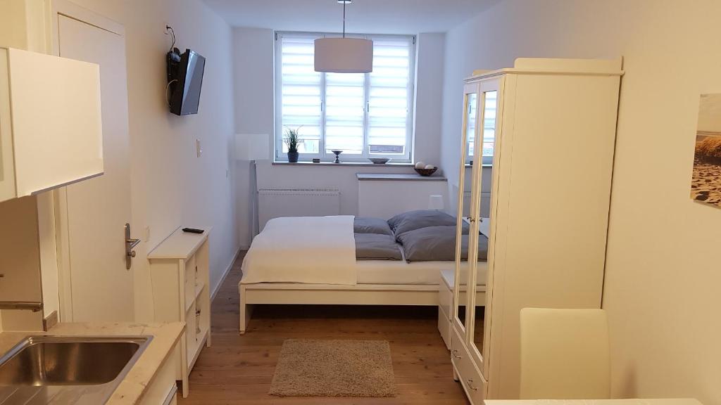 Postel nebo postele na pokoji v ubytování Miniapartment am Dalberg