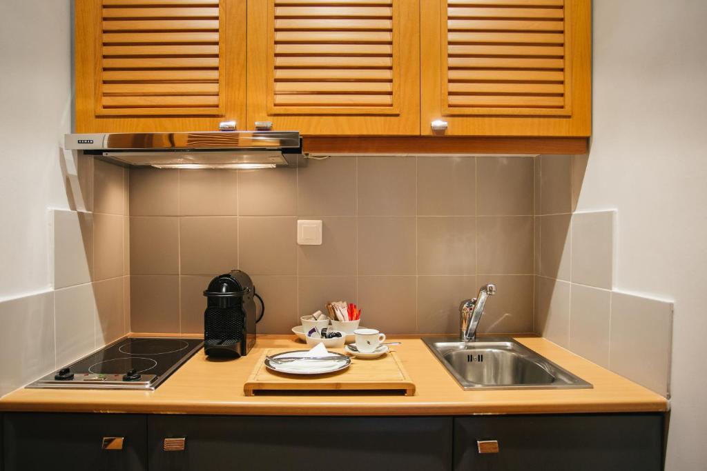 A kitchen or kitchenette at Mitropolitou Iosif Sea View Flat
