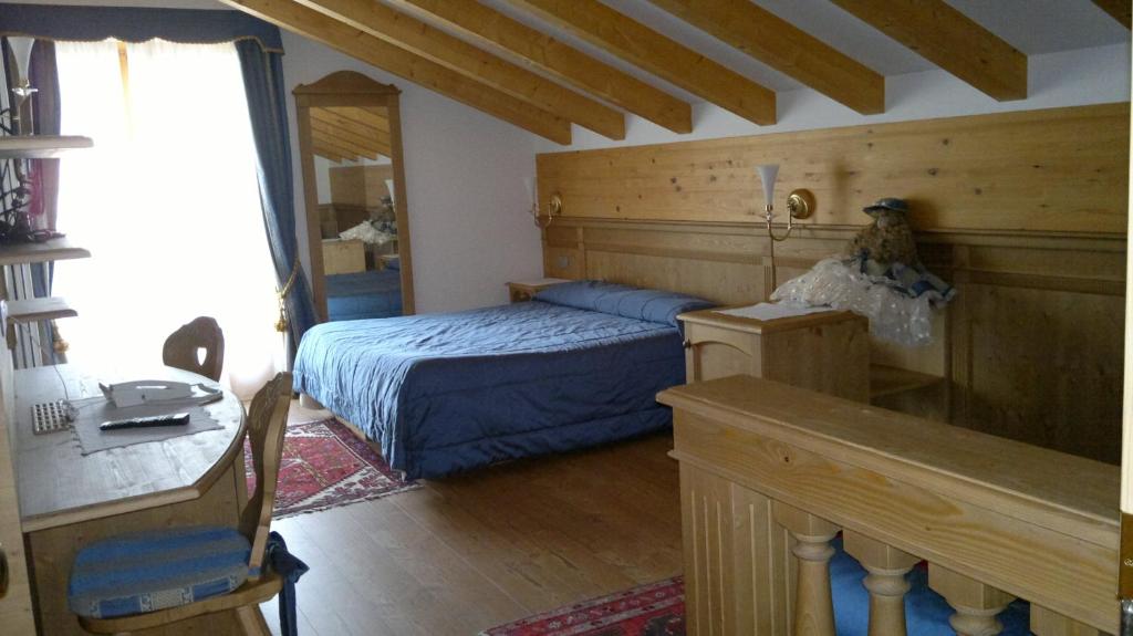 Postel nebo postele na pokoji v ubytování Hotel Sass Maor