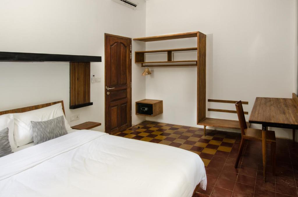 Postel nebo postele na pokoji v ubytování Pages Rooms Hotel