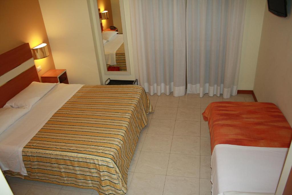 Postel nebo postele na pokoji v ubytování Hotel GF