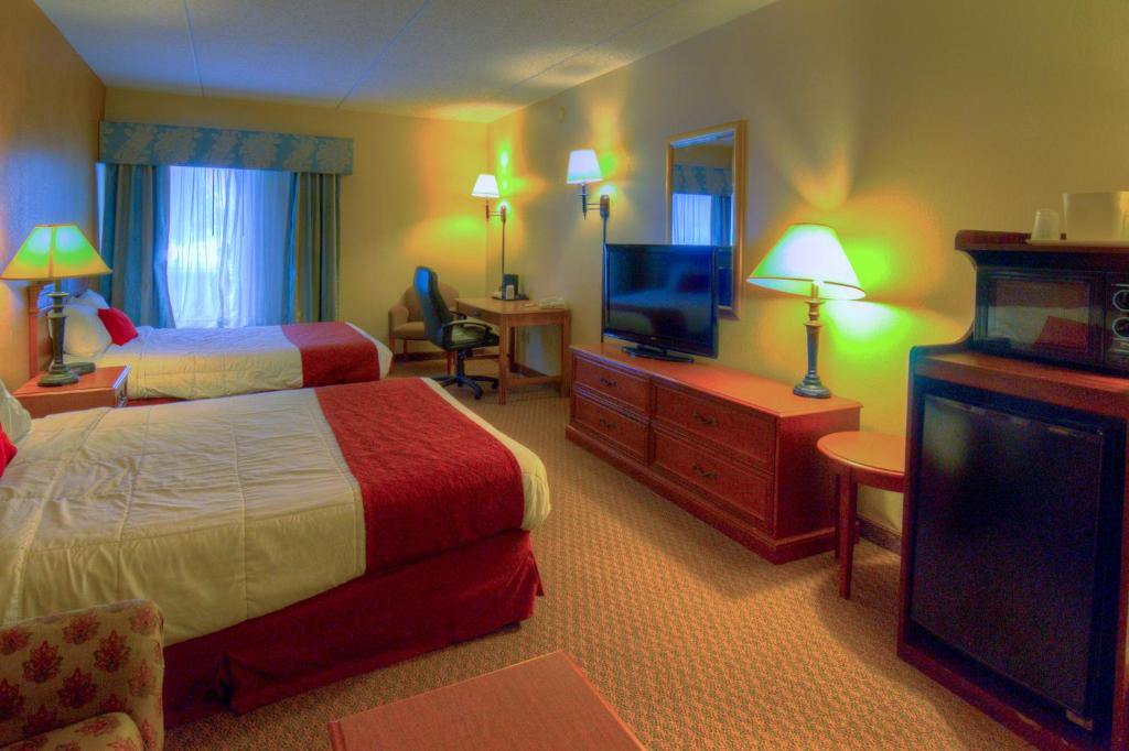 Postel nebo postele na pokoji v ubytování Hotel M Mount Pocono