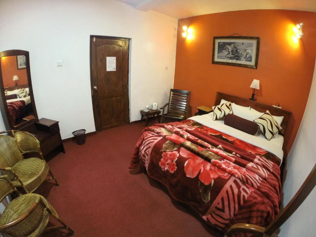 Postel nebo postele na pokoji v ubytování Nuwara Eliya Hills Rest