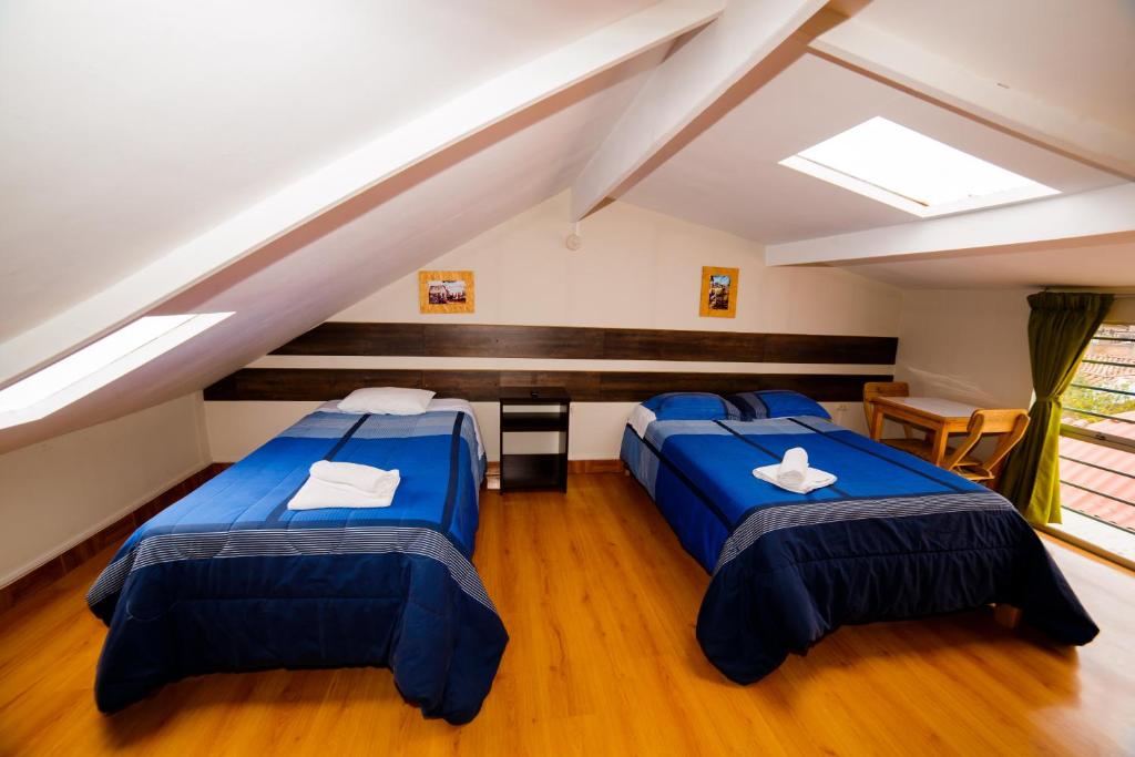 Postel nebo postele na pokoji v ubytování Ukukus Hostel
