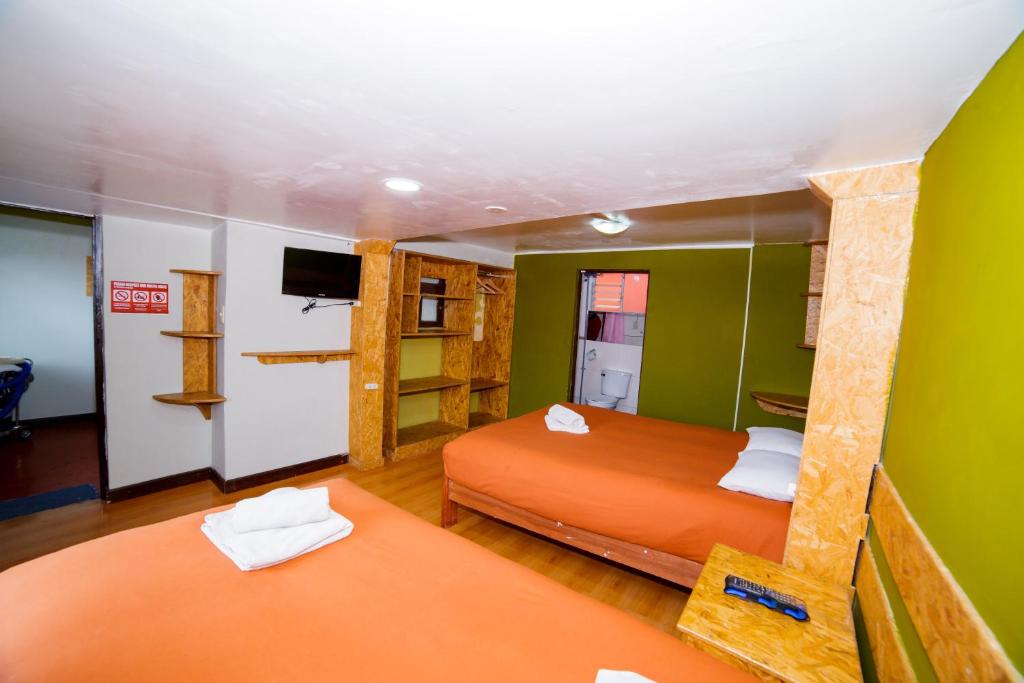 Postel nebo postele na pokoji v ubytování Ukukus Hostel