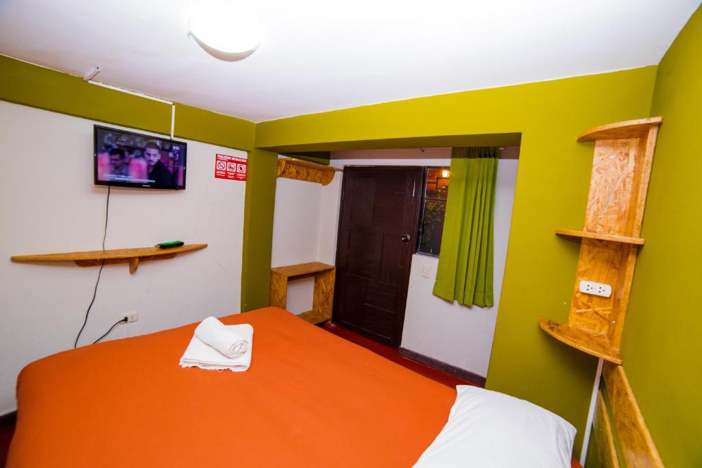 Postel nebo postele na pokoji v ubytování Ukukus Hostel