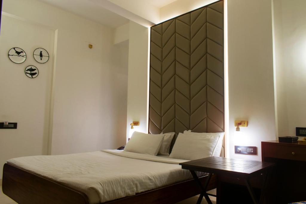 Postel nebo postele na pokoji v ubytování Hotel Cozy Inn
