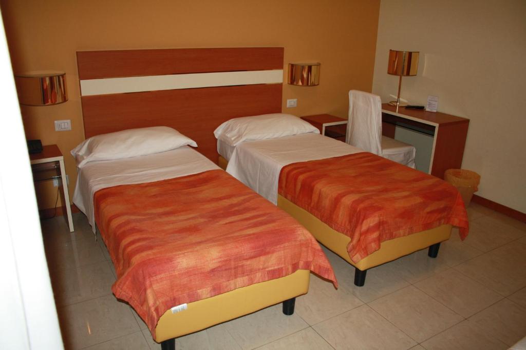 Postel nebo postele na pokoji v ubytování Hotel GF