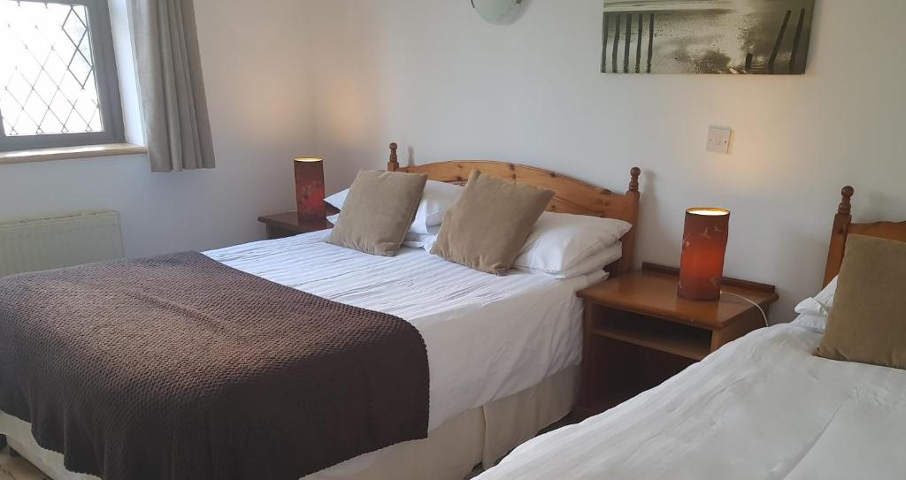 Postel nebo postele na pokoji v ubytování Ely House B&B