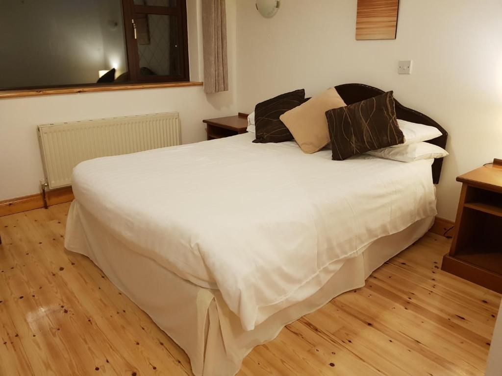 Postel nebo postele na pokoji v ubytování Ely House B&B