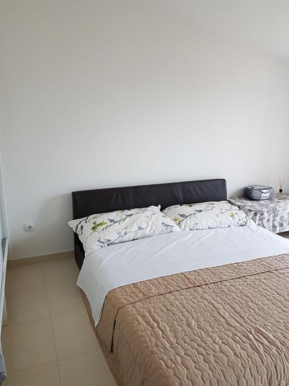 Posteľ alebo postele v izbe v ubytovaní Apartment Dijana