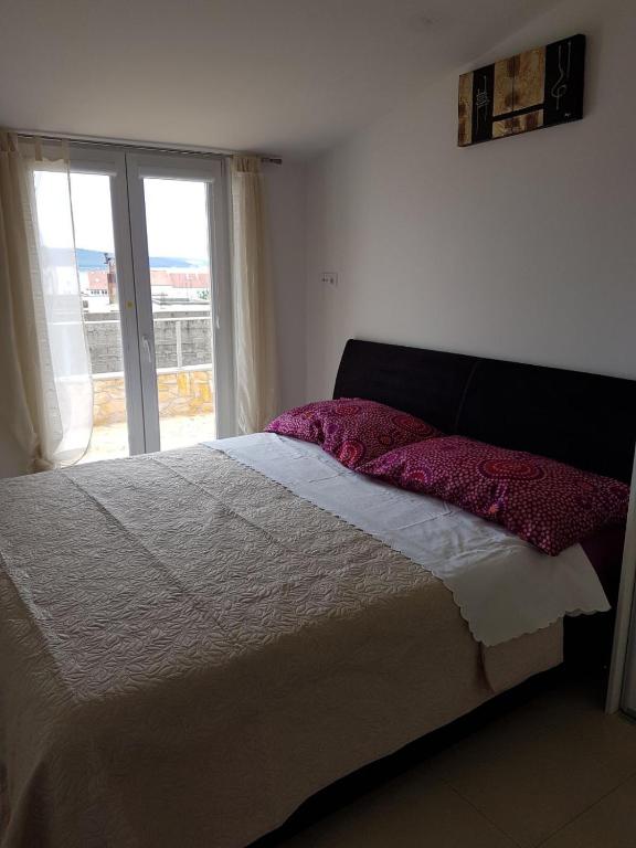 Posteľ alebo postele v izbe v ubytovaní Apartment Dijana