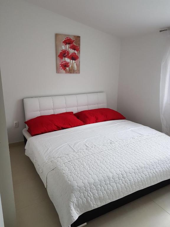 Posteľ alebo postele v izbe v ubytovaní Apartment Dijana