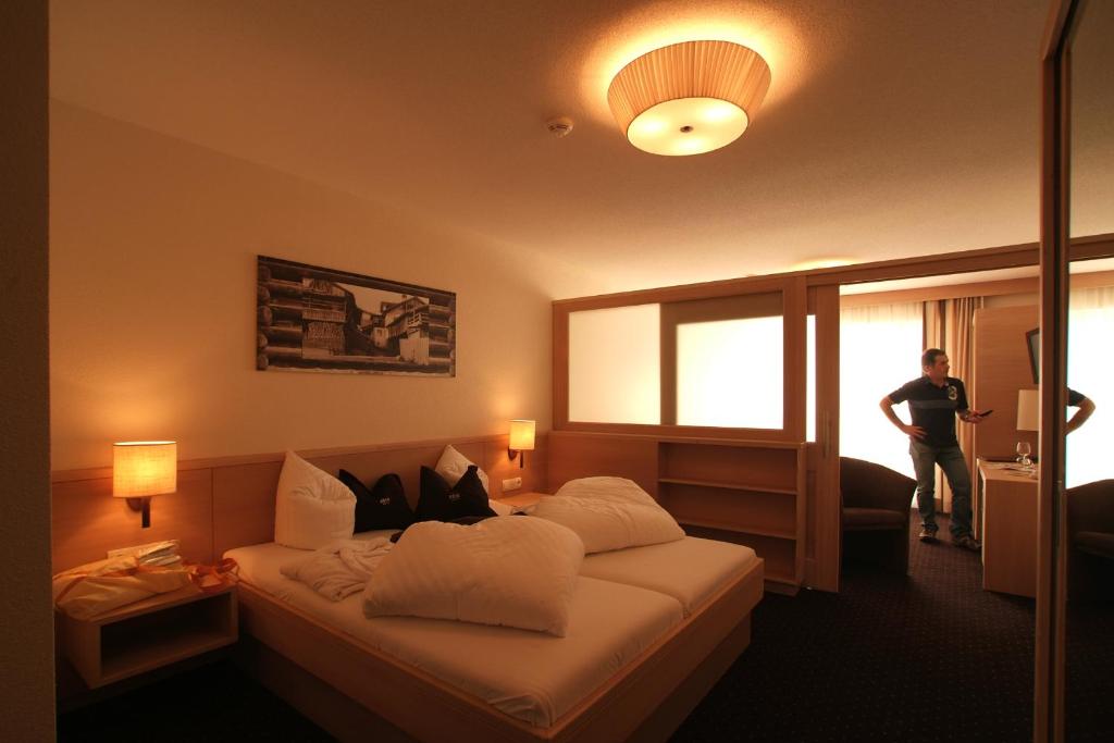 Postel nebo postele na pokoji v ubytování Hotel Röck Garni