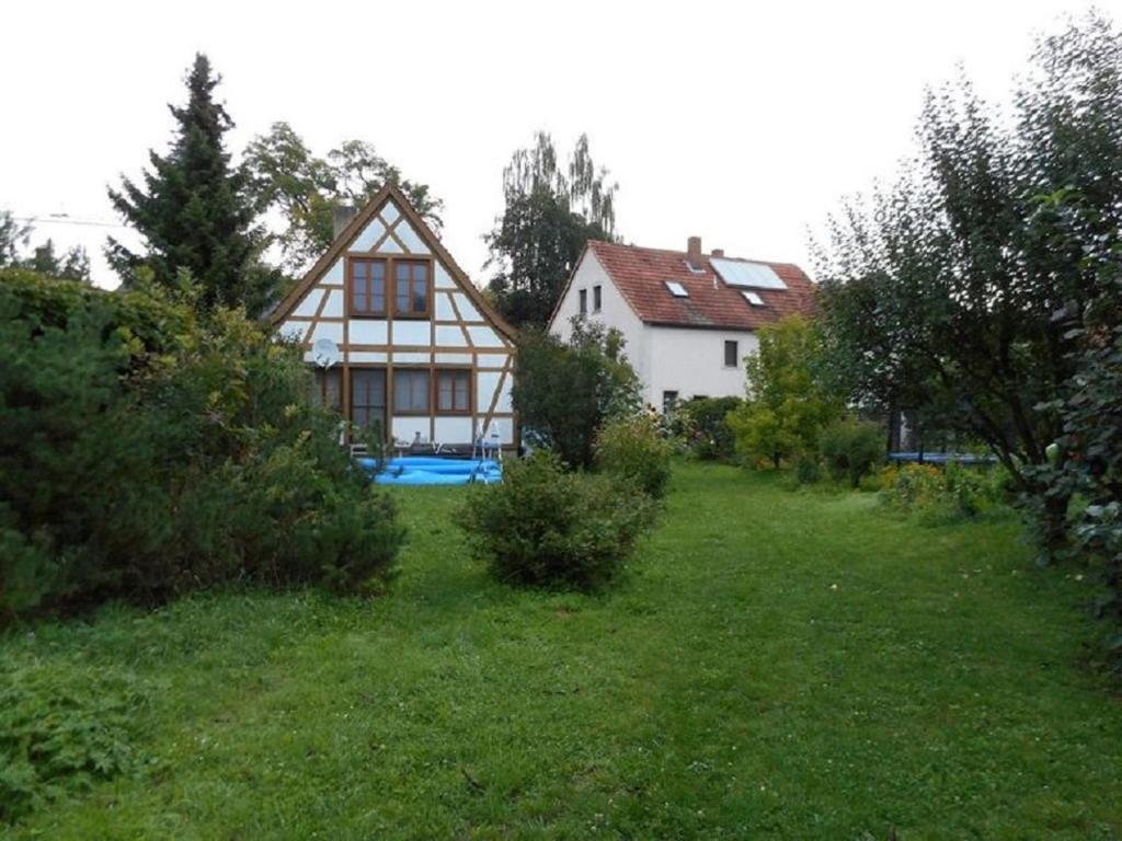 a large house on a hill with a yard at Gästehaus der Ehemaligen Schloßmühle in Ebelsbach