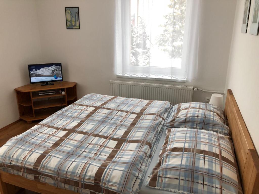 Postel nebo postele na pokoji v ubytování Pension Na Vyhlídce
