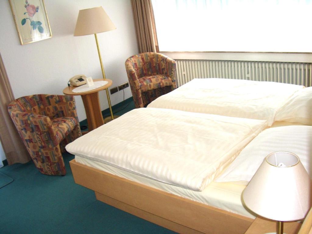 Postel nebo postele na pokoji v ubytování Hotel Ohrberg