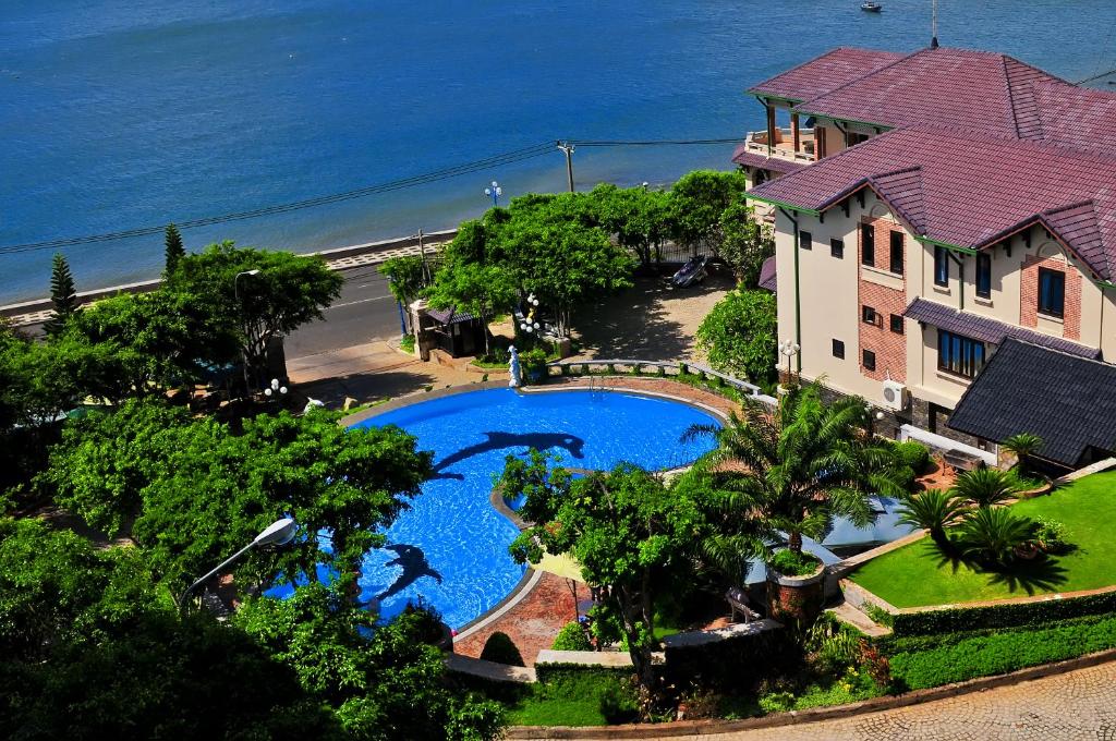 an aerial view of a house and a swimming pool at Beachfront Hotel in Vung Tau