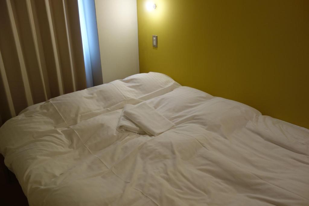 Letto o letti in una camera di Tomarotto Hostel