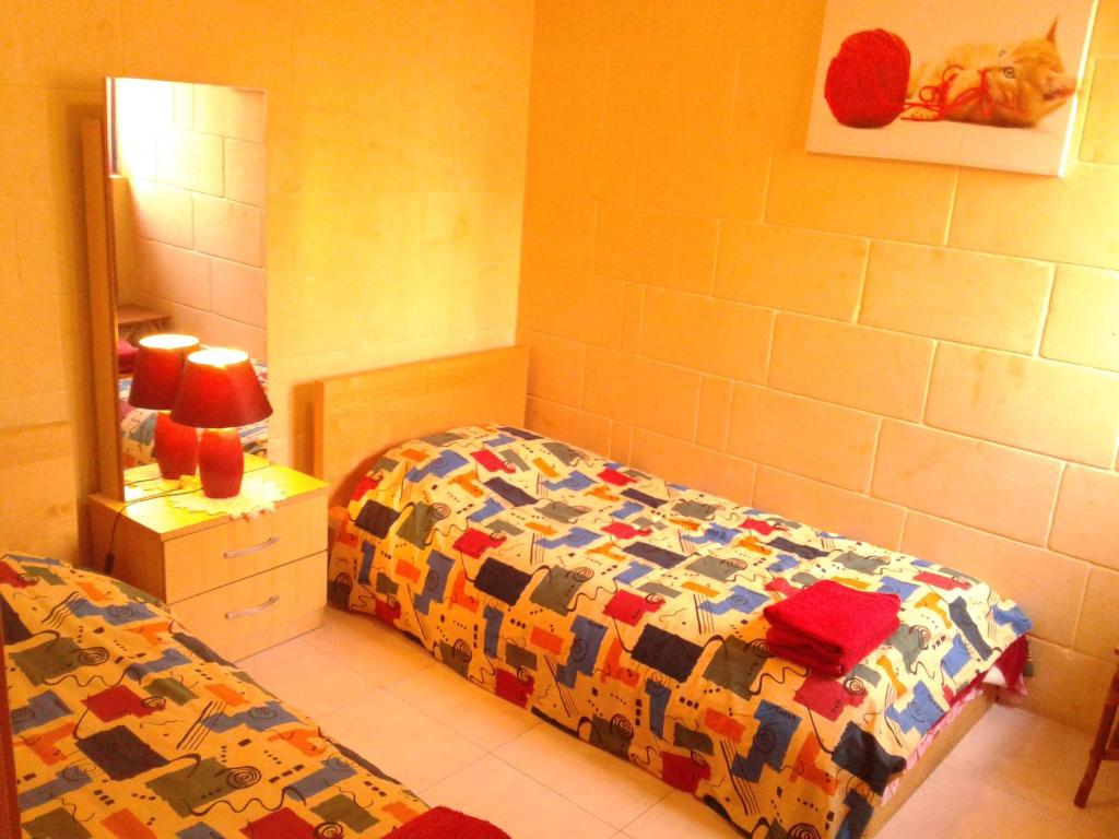 Postel nebo postele na pokoji v ubytování Apartment With Pool Gozo