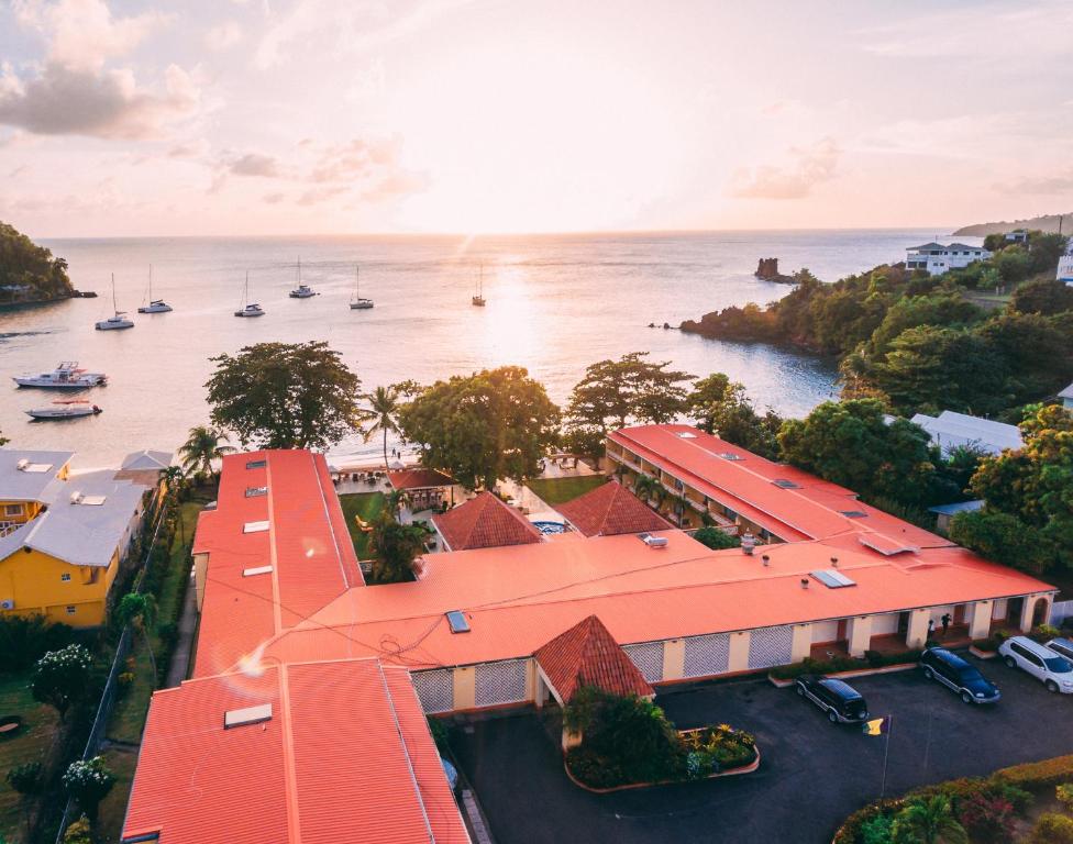 an aerial view of a building next to a body of water at Sunset Shores Beach Hotel in Kingstown
