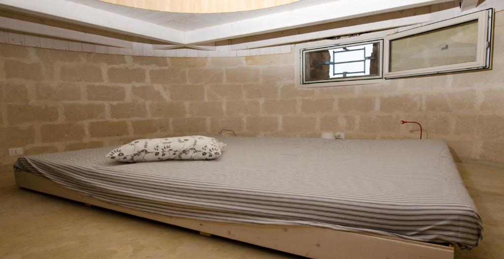 Postel nebo postele na pokoji v ubytování Le dune del marchese
