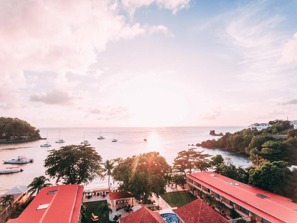 a view of a river with boats in the water at Sunset Shores Beach Hotel in Kingstown