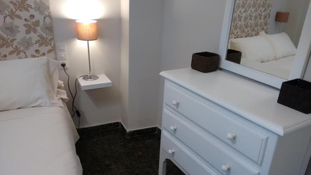 A bed or beds in a room at Apartamento valencia centro