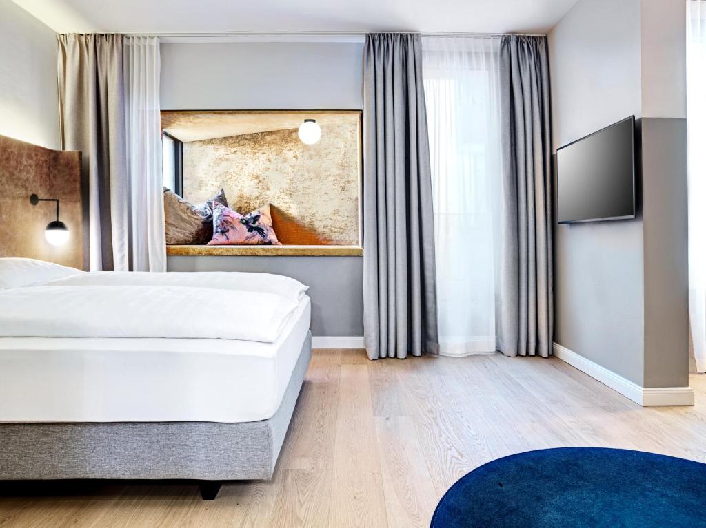 Postel nebo postele na pokoji v ubytování STAGE 12 Hotel by Penz